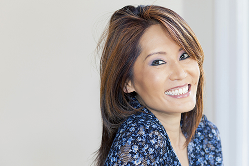 Portrait Of A Mature Asian Woman Smiling At The Camera